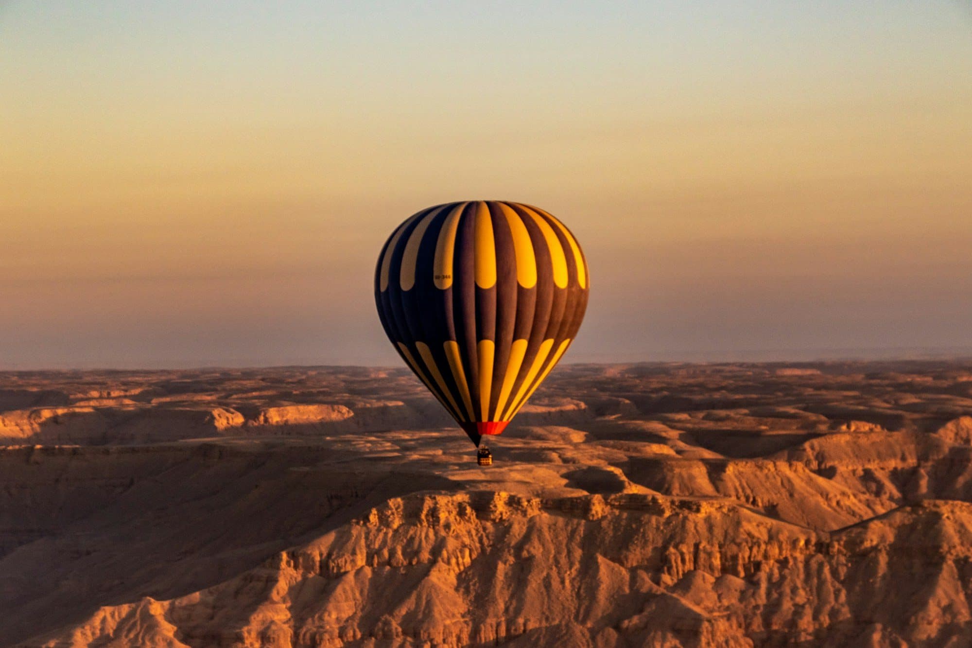 Hot-air balloon at sunrise over the Theban hills in Luxor