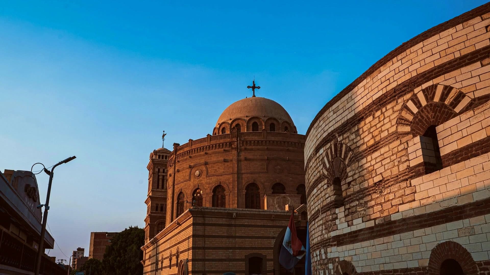 The Citadel of Cairo glowing at dusk above the city