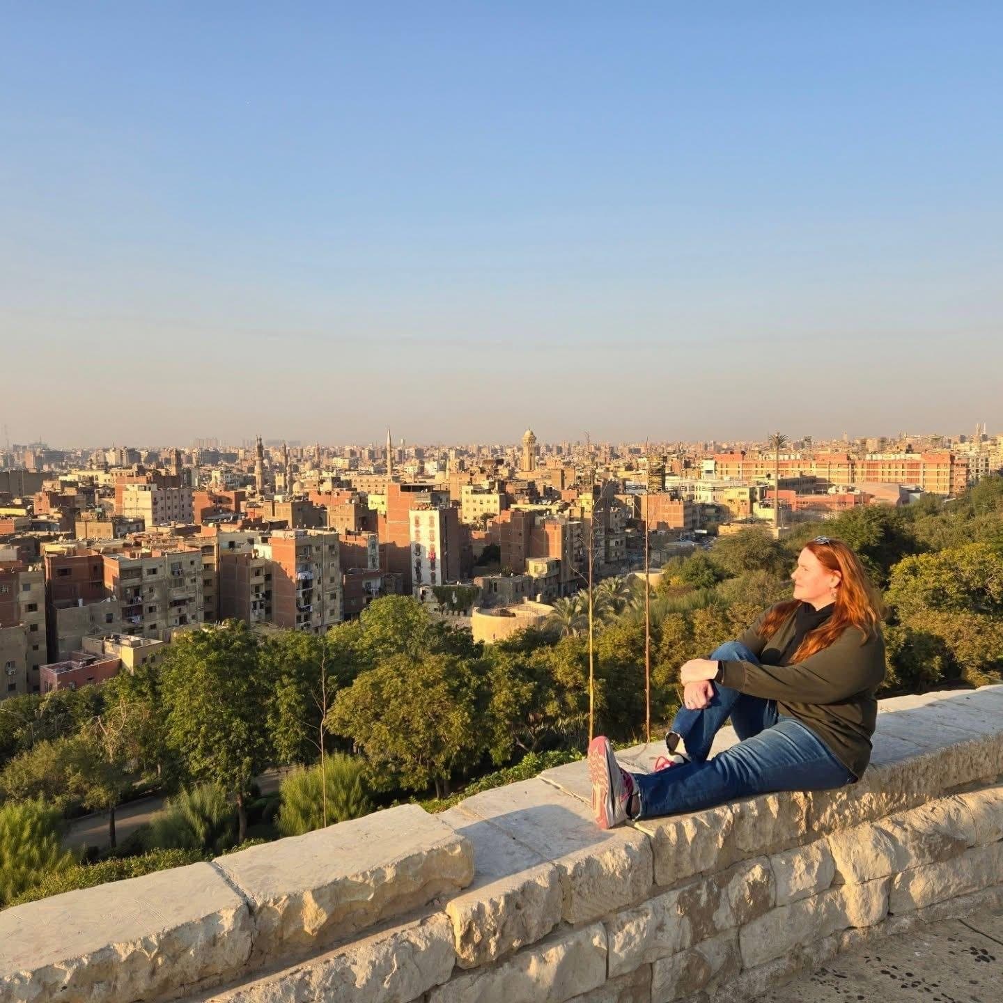 A guest looking out over the rooftops of Cairo