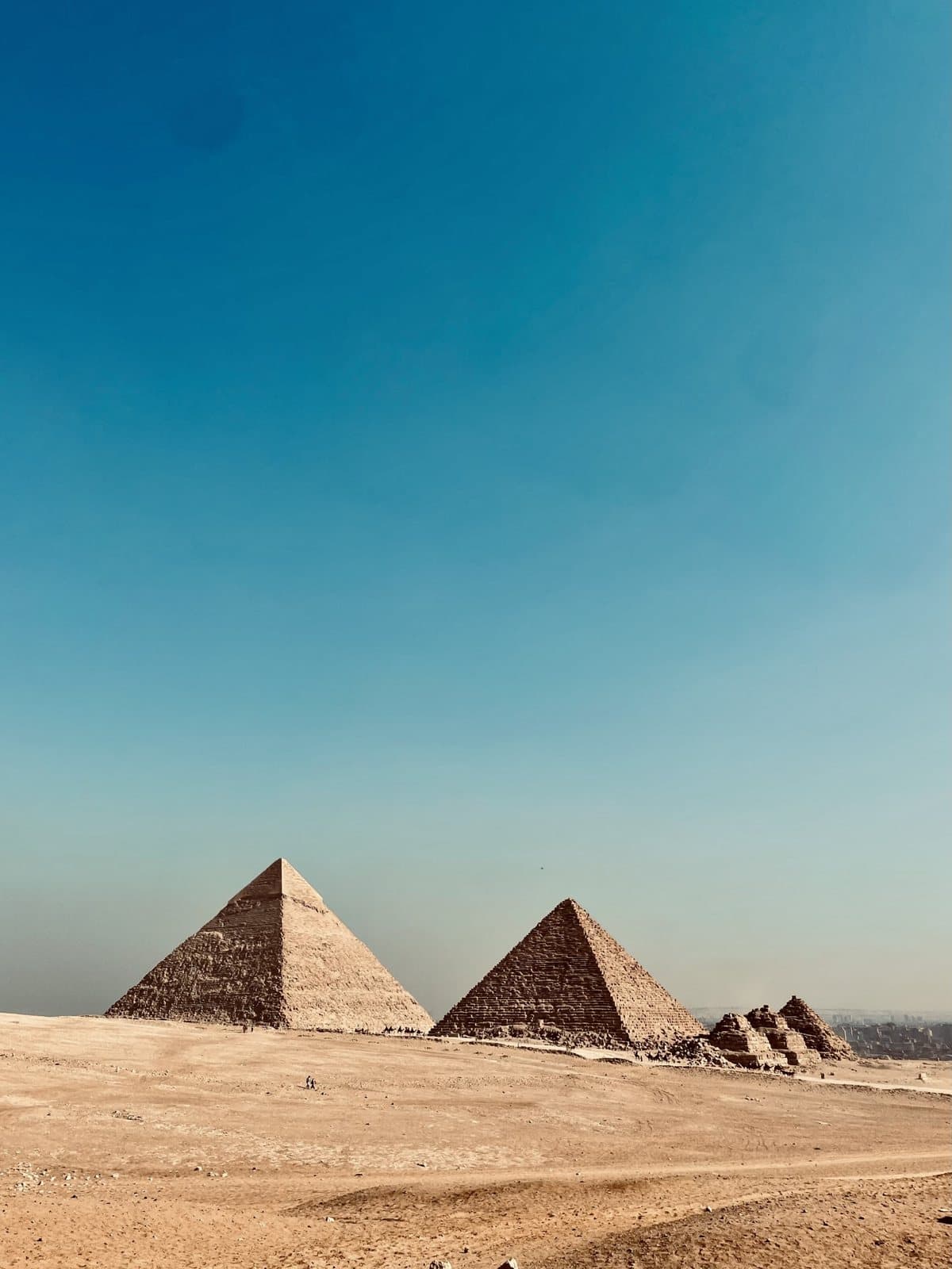 The Pyramids of Giza under a clear blue sky