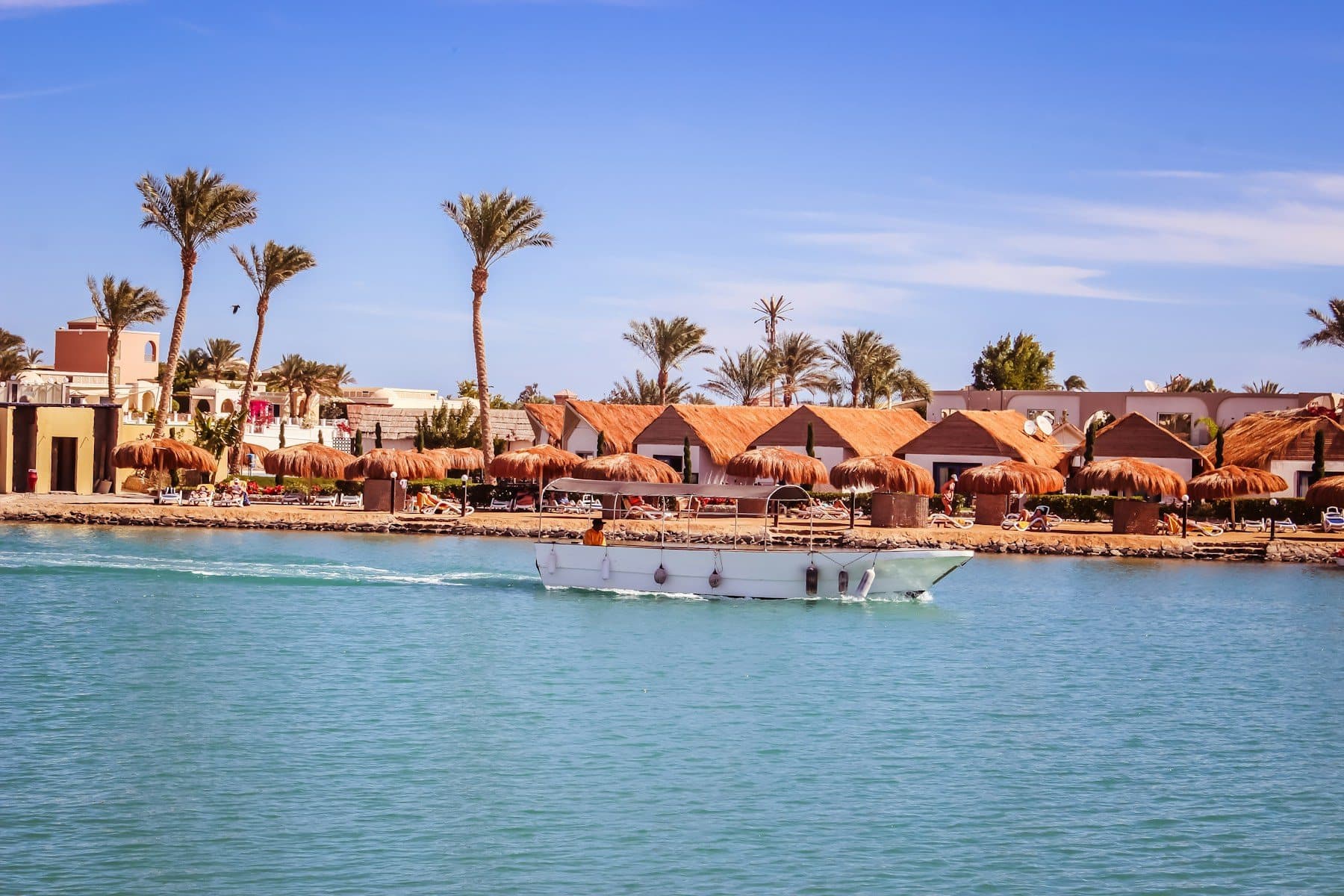 A boat gliding along the Red Sea shore