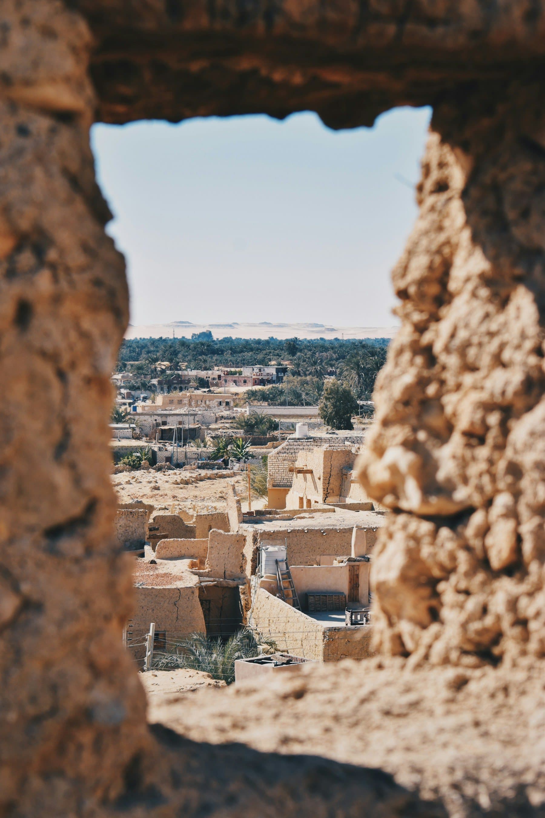 Siwa town seen through a window in the old fortress walls